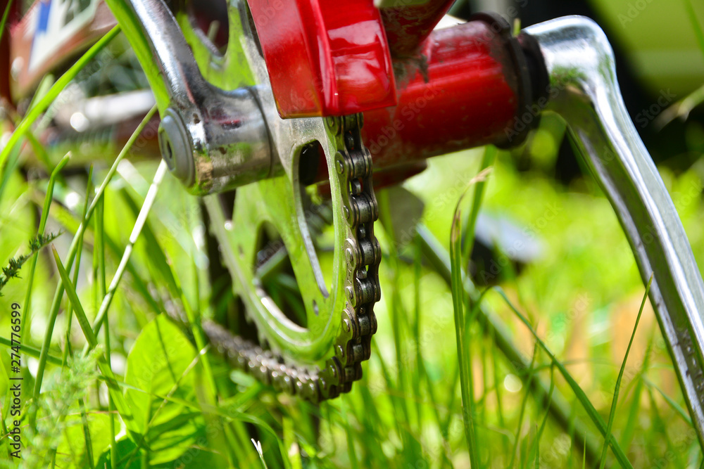 Handle, chain cover and pedal. Close-up of a fragment of a bicycle. Handle, chain cover and pedal. Close-up of a fragment of a bicycle.