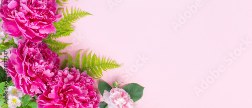 Canvas Print Pink floral banner, blooming peonies and roses with green leaves