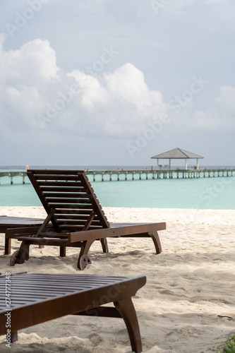 Beautiful beach with chaise lounge with ocean landscape