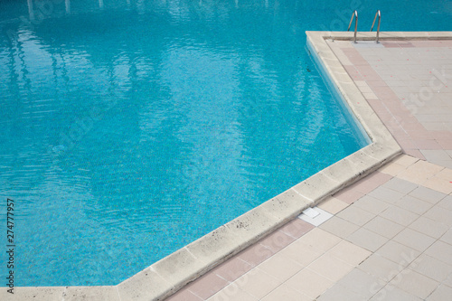 corner swimming pool detail with clear blue water