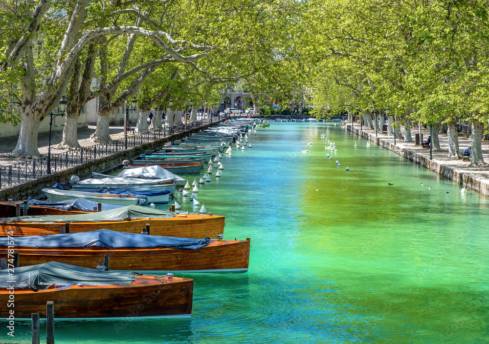 Colorful wooden boats in Annecy, France Colorful wooden boats in Annecy, France