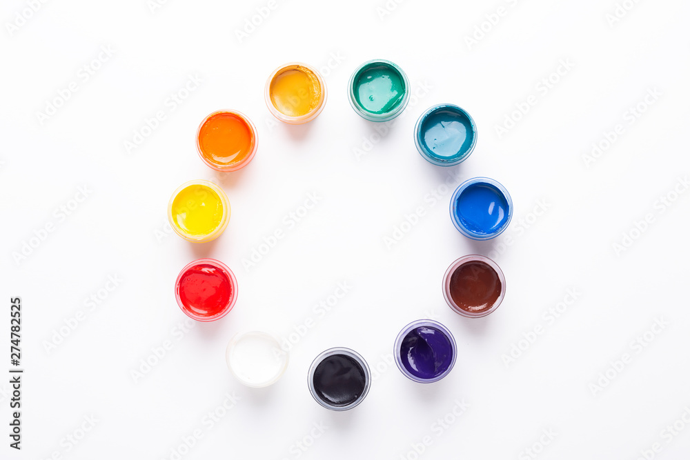 Multicolored gouache on a white background Circle shape Isolated Paints in containers Top view
