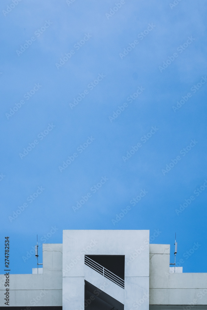 Abstract image of looking up at modern glass and concrete building. Abstract image of looking up at modern glass and concrete building.