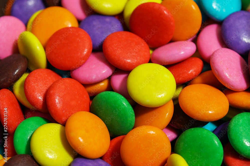 detail of colorful sweet chocolate pellets detail of colorful sweet chocolate pellets