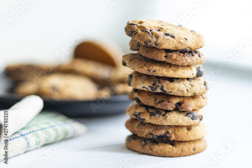 Stampa su tela stack of chocolate chip cookies on white background