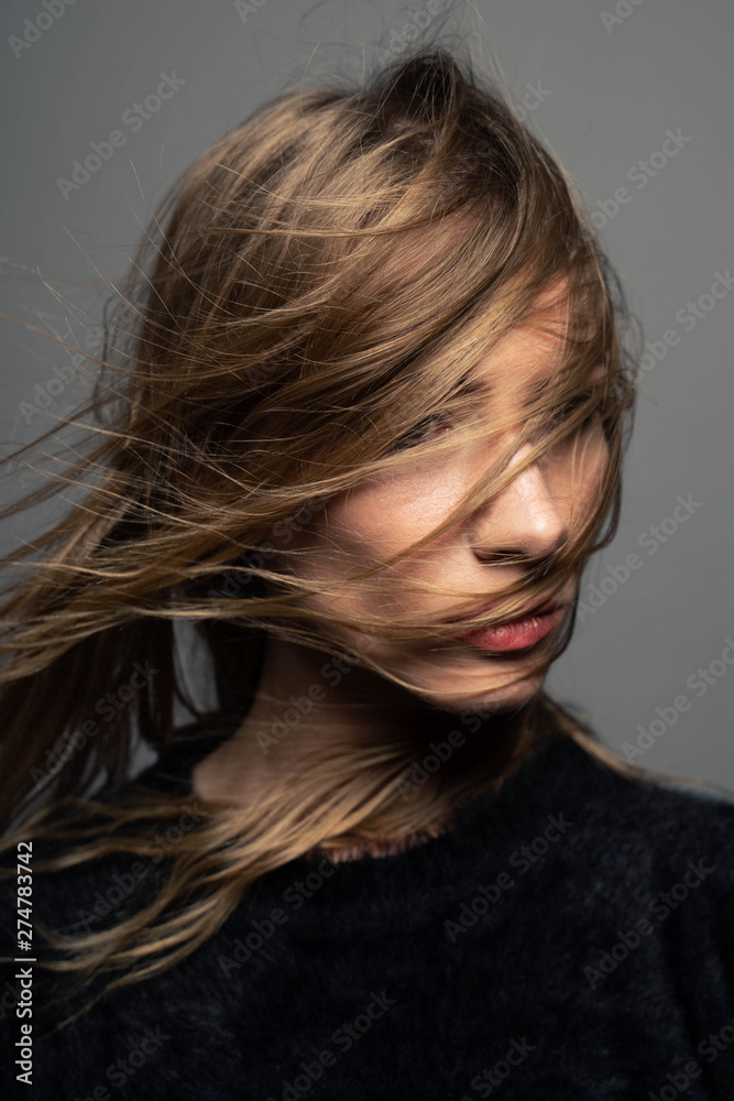 fashion look pretty young woman with hair on face excitement mood fashion look pretty young woman with hair on face excitement mood