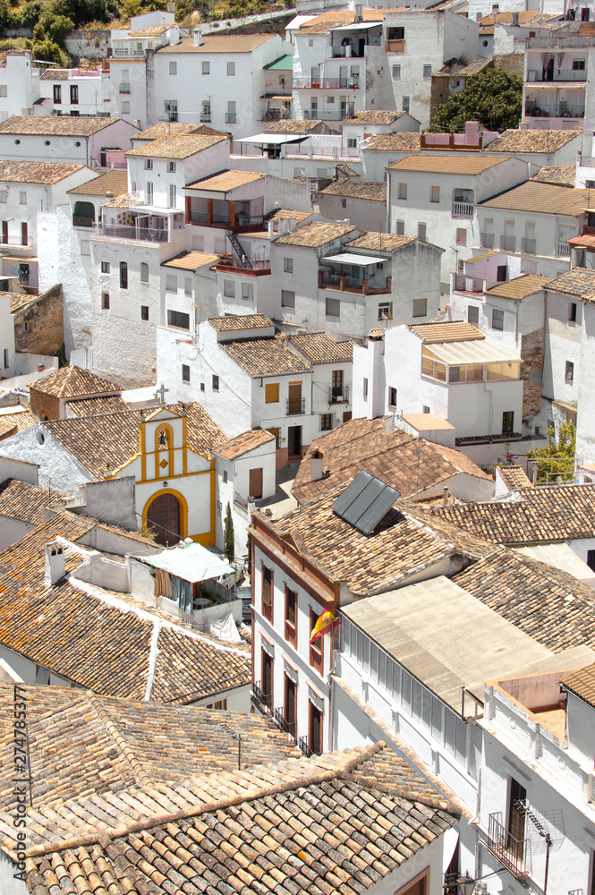 White houses and Hermitage of Setenil de las Bodegas, Cadiz, famous white town of Andalusia, Spain. Beautiful and sunny day in a village.