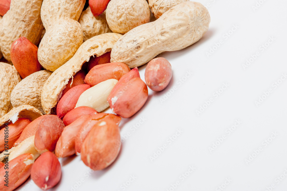Large peeled peanuts close-up of beans in the shell. Unpeeled peanuts in the shell. Peanuts, for background or texture. Growing organic protein Large peeled peanuts close-up of beans in the shell. Unpeeled peanuts in the shell. Peanuts, for background or texture. Growing organic protein