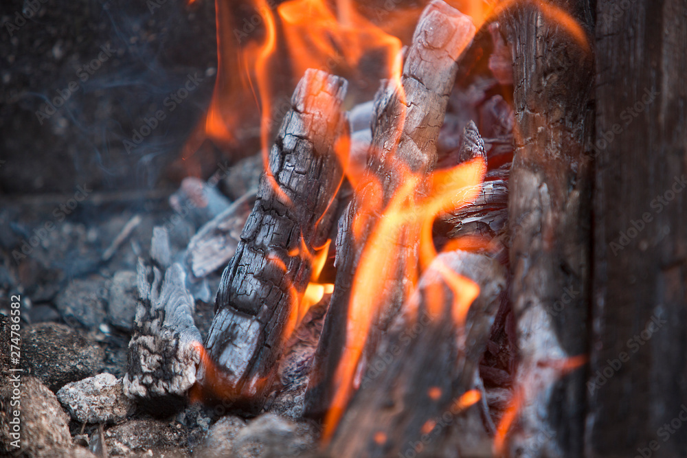 burning charcoal and firewood with smoke. Natural background