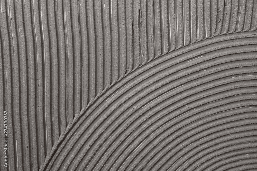 Lined grey concrete as background, top view. Tile installation Lined grey concrete as background, top view. Tile installation