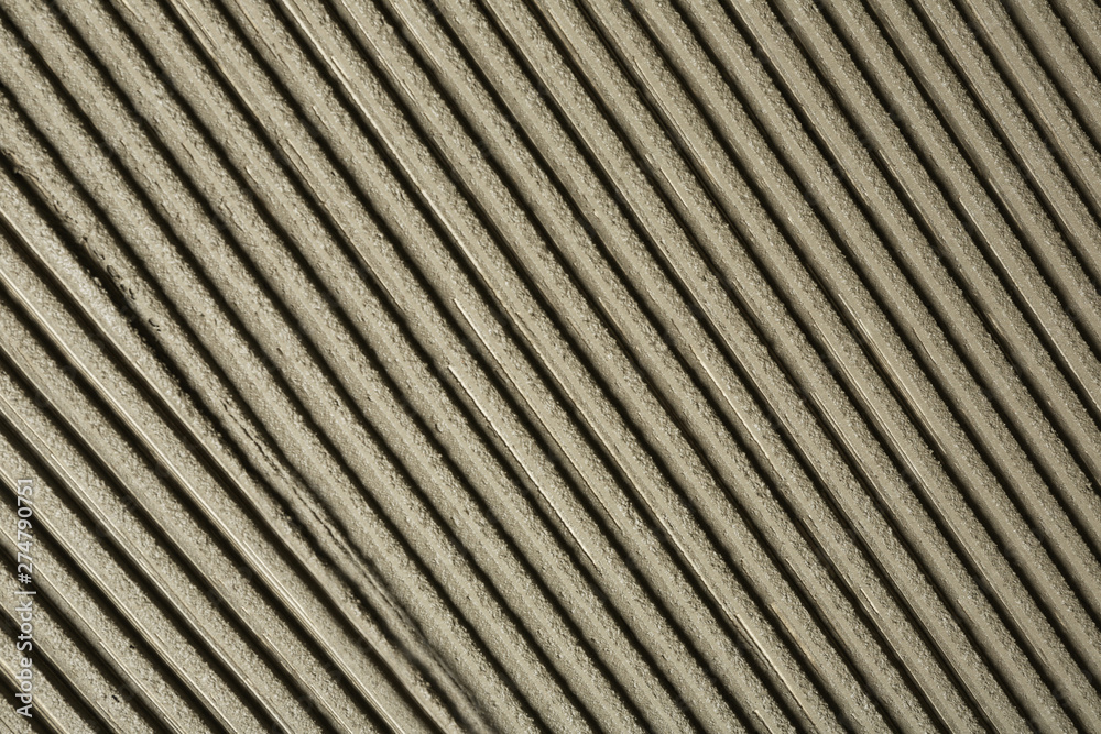 Lined grey concrete as background, top view. Tile installation Lined grey concrete as background, top view. Tile installation