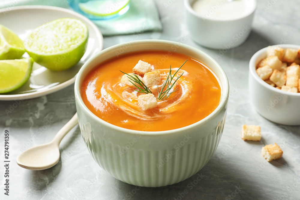 Bowl of tasty sweet potato soup served on table Bowl of tasty sweet potato soup served on table