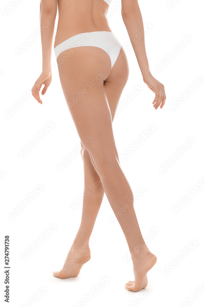 Slim young woman with smooth skin on white background. Beauty and body care concept