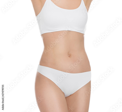 Slim young woman with smooth gentle skin on white background. Beauty and body care concept © New Africa