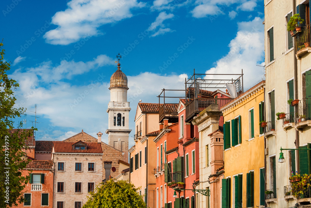 Venice historic center beautiful and characteristic old venetian houses with church bell tower
