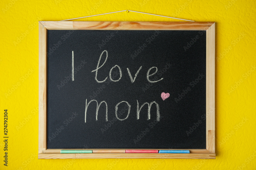 Blackboard with written text I LOVE MOM on color background Blackboard with written text I LOVE MOM on color background