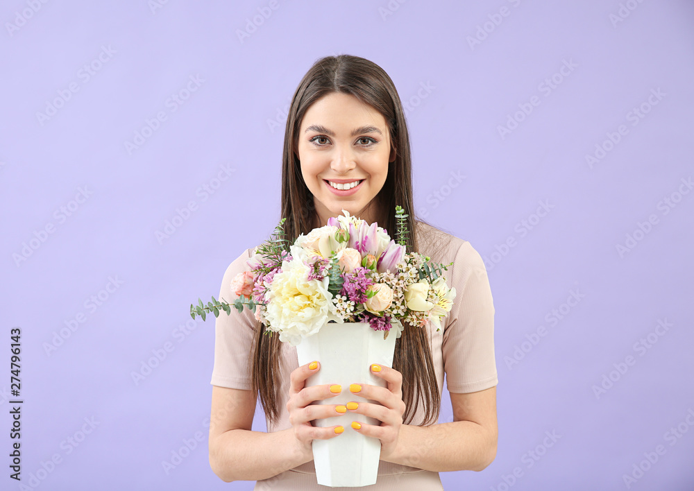 Beautiful young woman with bouquet of flowers on color background Beautiful young woman with bouquet of flowers on color background