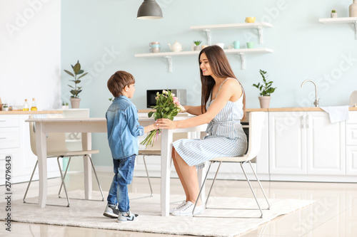 Son greeting his mother wit...