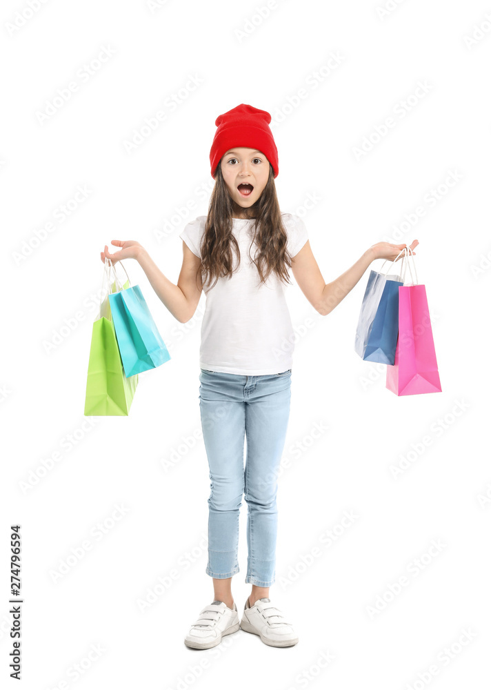 Shocked girl in jeans and with shopping bags on white background Shocked girl in jeans and with shopping bags on white background