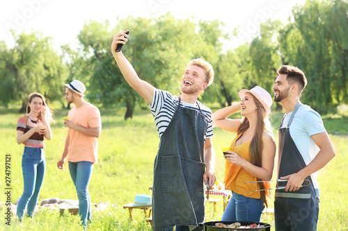 Friends taking selfie while...