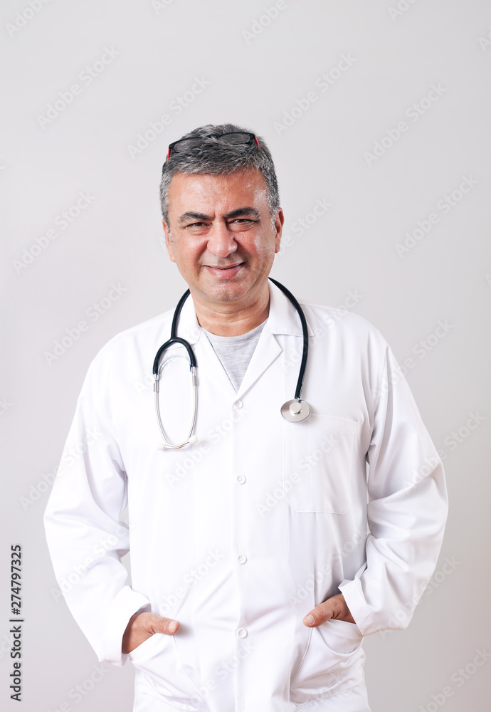 Portrait of an male doctor in white coat.