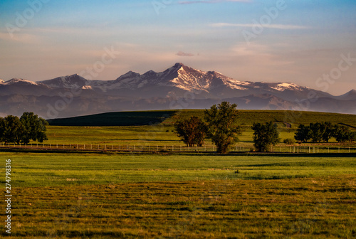 Sunrise in on the Plains of Colorado with Mountains in background photo