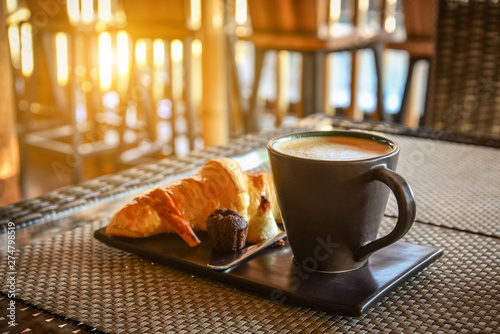 Coffee latte with croissant