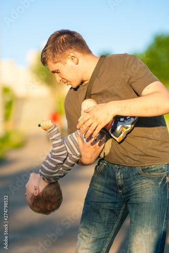 Young Father Playing With is Son photo