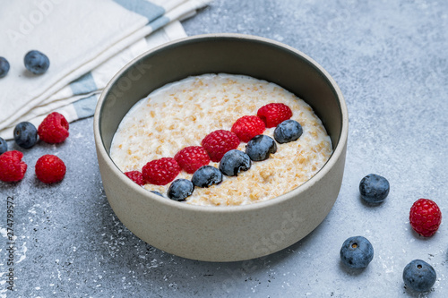 Oatmeal with berries on bowl