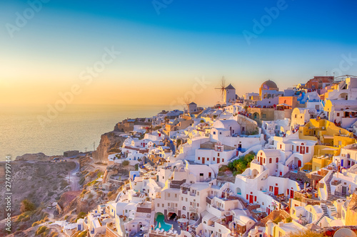 Cityscape of Oia Village in Santorini Island Located on Red Volcanic Caldera Before Sunset.