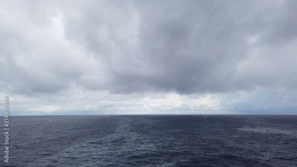 Stormy clouds over dark ocean ready for raining