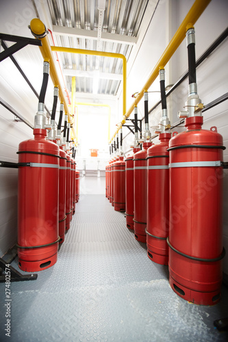 Bilde på lerret Background image of narrow corridor of industrial room with air tanks connected