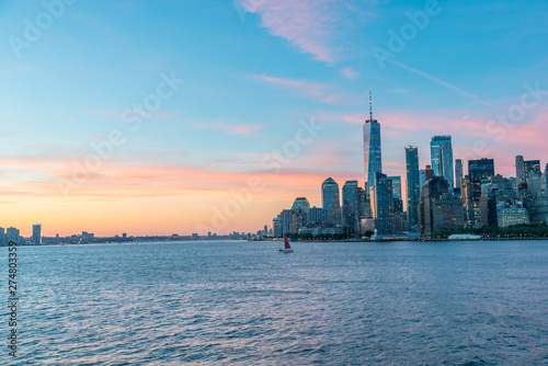View of Downtown Manhattan With Lights on Building Still On During Sunrise