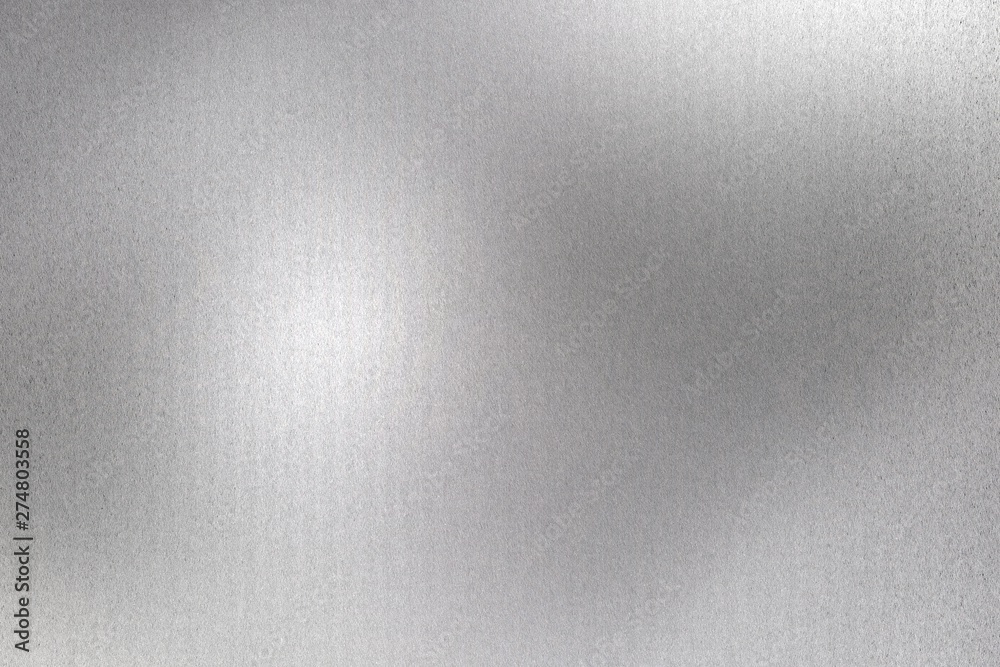 Glowing brushed silver foil metallic sheet, abstract texture background Glowing brushed silver foil metallic sheet, abstract texture background