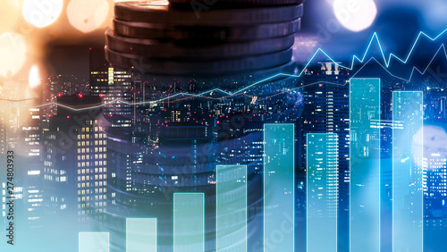 Double exposure of city view , diagram bar and line graph , rows of coins for finance , money , investment and business concept background