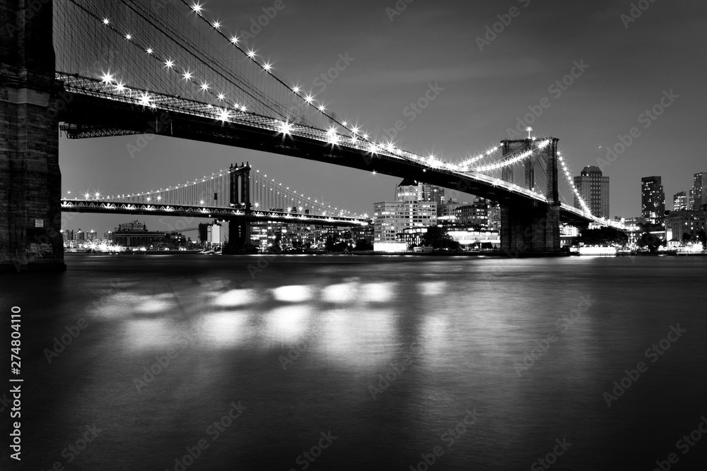 Black and White  Picture of the Brooklyn Bridge Lighted Up At Night