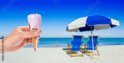 Fototapeta Naklejka Na Ścianę i Meble -  sun loungers and a beach umbrella on silver sand,  vacation concept