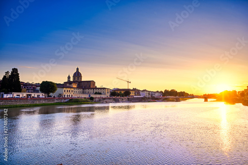 June 6, 2019 - Florence, Italy - A view of Florence, along the Arno River, in the Tuscany region of Italy at sunset.