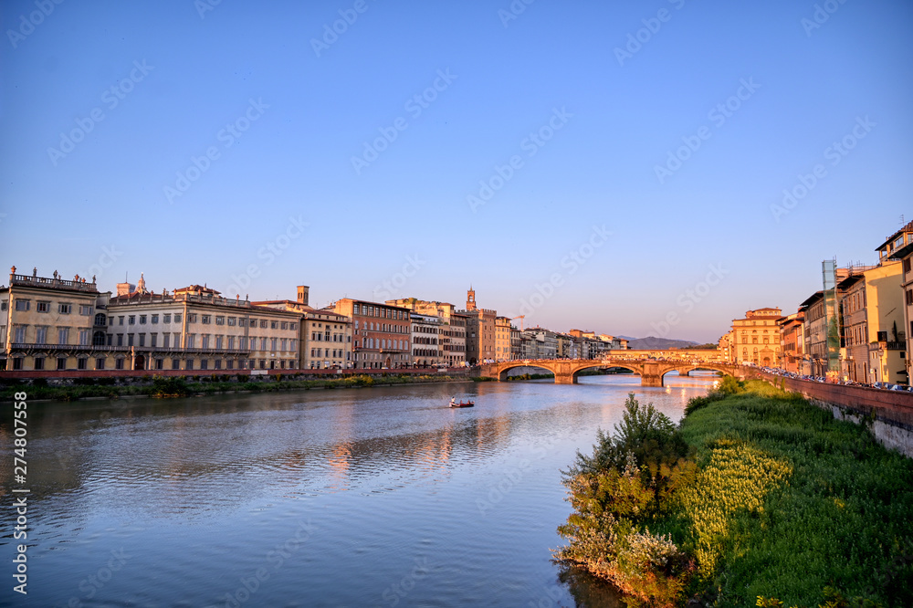 June 6, 2019 - Florence, Italy - A view of Florence, along the Arno River, in the Tuscany region of Italy at sunset.