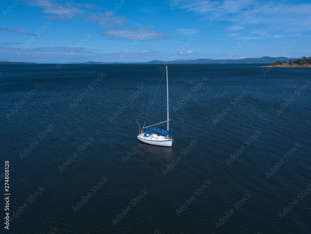 Lone sailboat on the water