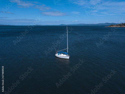 Lone sailboat on the water