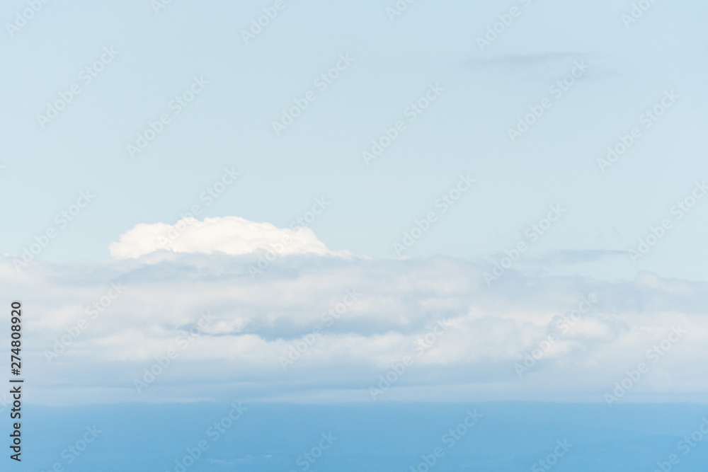 Light and airy blue sky and white clouds as a nature background