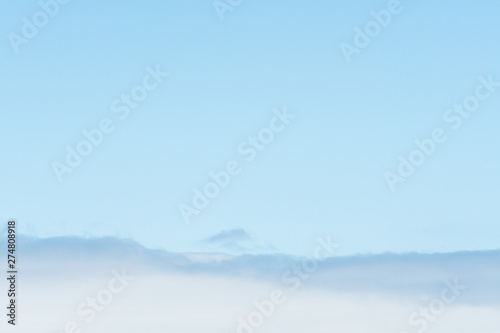 Light and airy blue sky and white clouds as a nature background