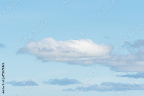 Light and airy blue sky and white clouds as a nature background