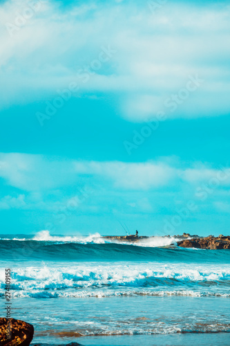 Waves and Rocks at Beach at Sunrise