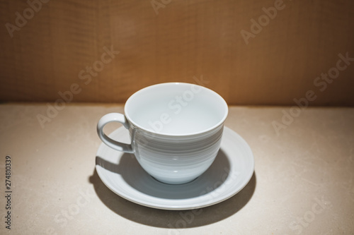 Wallpaper Mural Closeup coffee cup with lighting and wooden background Torontodigital.ca