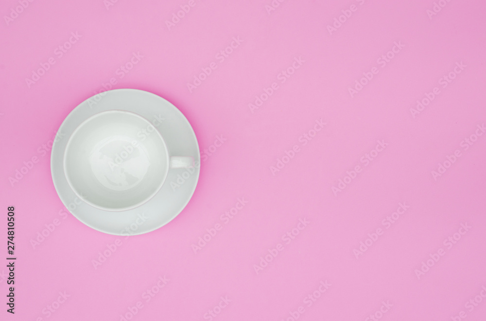 Vintage white coffee cup empty on  pink pastel background. Copy space