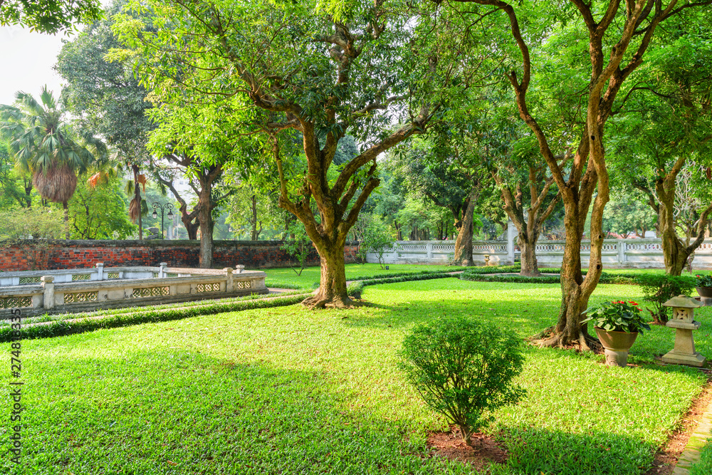 Scenic traditional Vietnamese garden at the Temple of Literature - obrazy, fototapety, plakaty 
