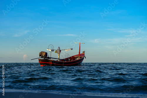 Fishing boat on the sea with sky and cloud.