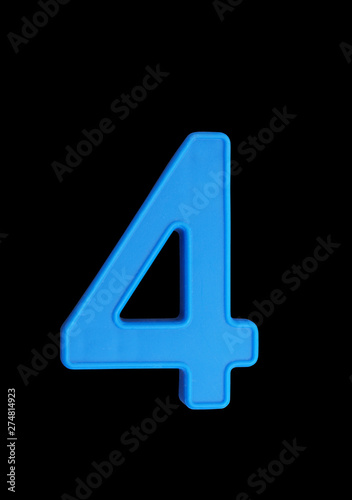 Plastic number isolated on black background, number 4